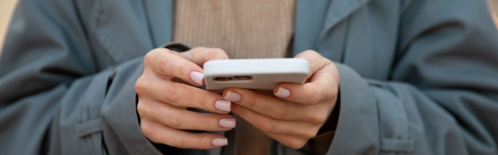 Close Up Hands Holding Smartphone