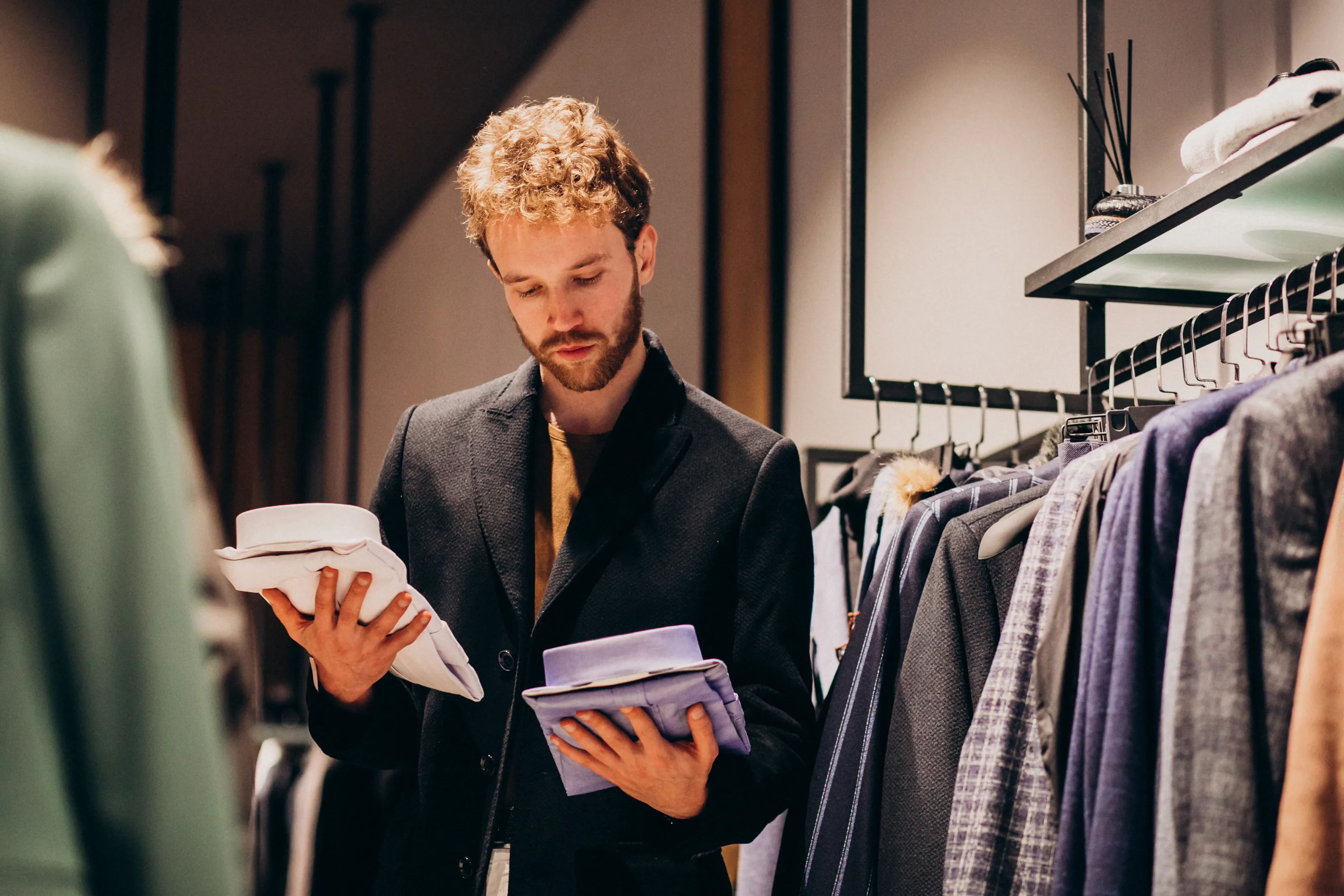 Young Handsome Man Choosing Shirt Shop